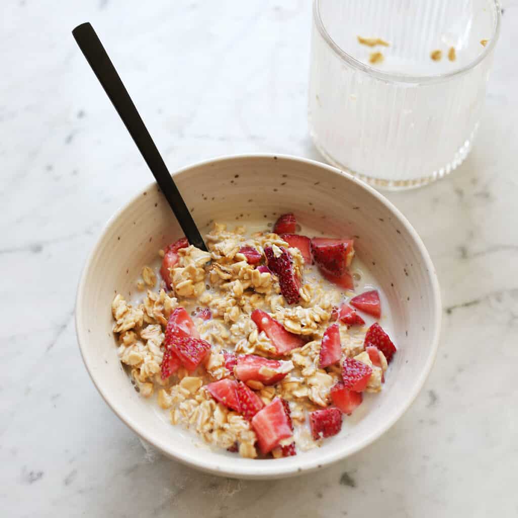 overnight oatmeal in a bowl with chopped strawberries